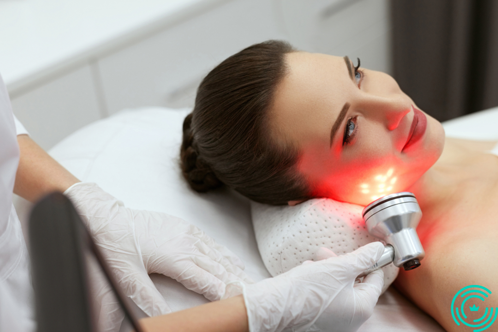 A woman in an esthetician's salon who gets laser treatment on her face